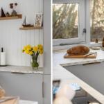 Kitchen with marble countertop, window, bread, and decor.