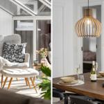 Seating area with armchair and dining table with lamp and flowers.