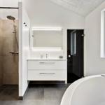 Bathroom with shower, sink and whirlpool tub.