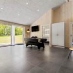 Room with pool table, TV, and view of garden