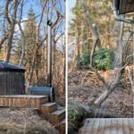 Cabin with wooden deck, outdoor hot tub, and shower in the woods.