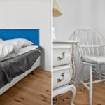 Bedroom with bed and chair. Blue headboard, white dresser, wooden floor.