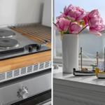 Kitchen with stove and window with flowers and ship models
