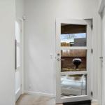 Behind the door is a grill on the patio.