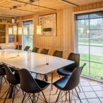 Large dining area with table, chairs, and window to the outside.
