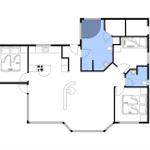 Wohnung mit zwei Schlafzimmern, Küche und Bad. Flur mit Treppe.