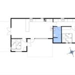 Geschossplan zeigt zwei Schlafzimmer, Küche, Bad und Wohnbereich mit Kompass.