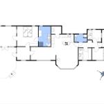 Grundriss einer Wohnung mit Küche, Bad und Schlafzimmern.