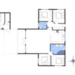 Zwei Schlafzimmer, Küche, Bad und Wohnbereich mit Kompass.