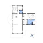 Geschossplan zeigt Wohnfläche mit Küche, Schlafzimmer und Badezimmer.