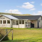 Haus mit Garten und Terrasse vor Dünen