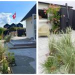 Terrasse mit Garten, Flagge und Sitzgelegenheiten. Rosen und Gräser schmücken den Außenbereich.