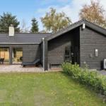 Modern wooden cabin with terrace, garden, and outdoor shower. Number 4.