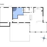 Floor plan shows living area, kitchen, and bathroom with compass
