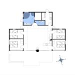 Gebäudegrundriss mit vier Schlafzimmern und zentraler Küche.