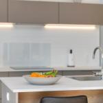 Kitchen with countertop, sink, and fruit bowl.