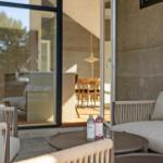 Terrace with seating and view into the house. Drinks on the table.