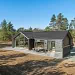 Modern villa with large glass area and terrace in the woods