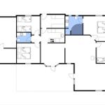 Grundriss einer Wohnung mit Küche, Bad und mehreren Schlafzimmern.