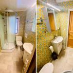 Badezimmer mit Dusche, Toilette und Waschbecken. Wandtapete in gelb-grün.
