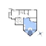 Basement with bathroom, stairs, and living area with bathroom and kitchen.