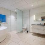 Bathroom with bathtub, toilet, and sink