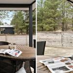 Terrasse mit Tisch und Stühlen, Blick auf Wald und Holzzaun.