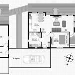 Dieses Haus hat eine Küche, ein Wohnzimmer, ein Schlafzimmer und eine Garage.
