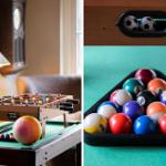 Foosball table and billiard balls on green table