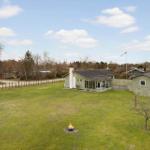 House with large garden and fire pit. Danish flag waving.