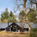 Modern cabin with large glass area in the forest