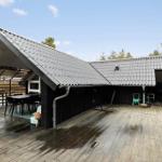 Deck with seating and grill under roof