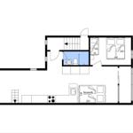 Wohnung mit Küche, Bad, Schlafzimmer und Wohnbereich mit Schlafcouch.