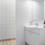 Bathroom with sink, mirror, and shower