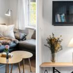Living room with sofa, table and window. Wall cabinet with books and lamp on table.