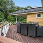 Deck with seating area and view into the forest