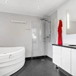 Bathroom with shower, bathtub, and sink