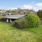 House with garden and terrace. View of surrounding houses.