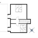 Ground floor with bedroom and staircase to upper level.