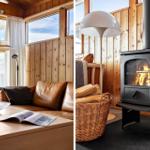 Living room with wooden walls and sofa. Wood-burning stove with fire.