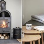 Kaminofen mit Holzstapel und Tisch mit Buch und Tasse.