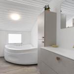 Bathroom with bathtub, sink, and mirror. Skylight window and modern fixtures.