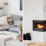 Gray sofa with cushions and table with flowers. Fireplace with burning fire on the wall.