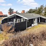 Black vacation home with terrace and garden. Number 5. View of surrounding houses.