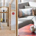 Living area with sofa and table. Hallway with wooden beams and fireplace.