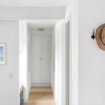 Hallway with straw hat on wall and picture on wall