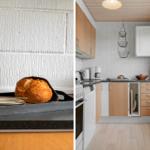 Küche mit Holzschrank und Steinplatten. Brot auf Tablett. Fenster mit Pflanze.