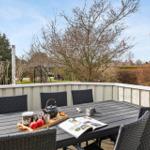 Terrace with table and chairs, tea and magazine ready.