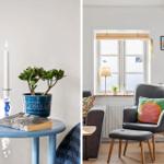 A room with a gray armchair, window, and small table with plant and candles.