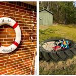 Rettungsring an Backsteinwand und Sandkasten mit Reifen im Garten
